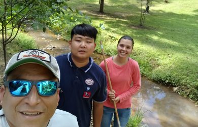 From left, Dr. Adrian Vasquez with Mercer University students Andy Yin and Bryce Williams after a day in the field collecting aquatic organisms.