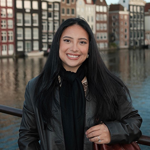 Portrait of Andre Arce with an European city on the background