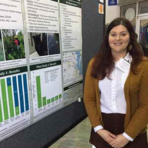 Picture of Christina Espada (M.P.H) during a poster session